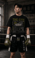 Boxer wearing The Gym black Japanese boxing T-shirt with olive gloves
